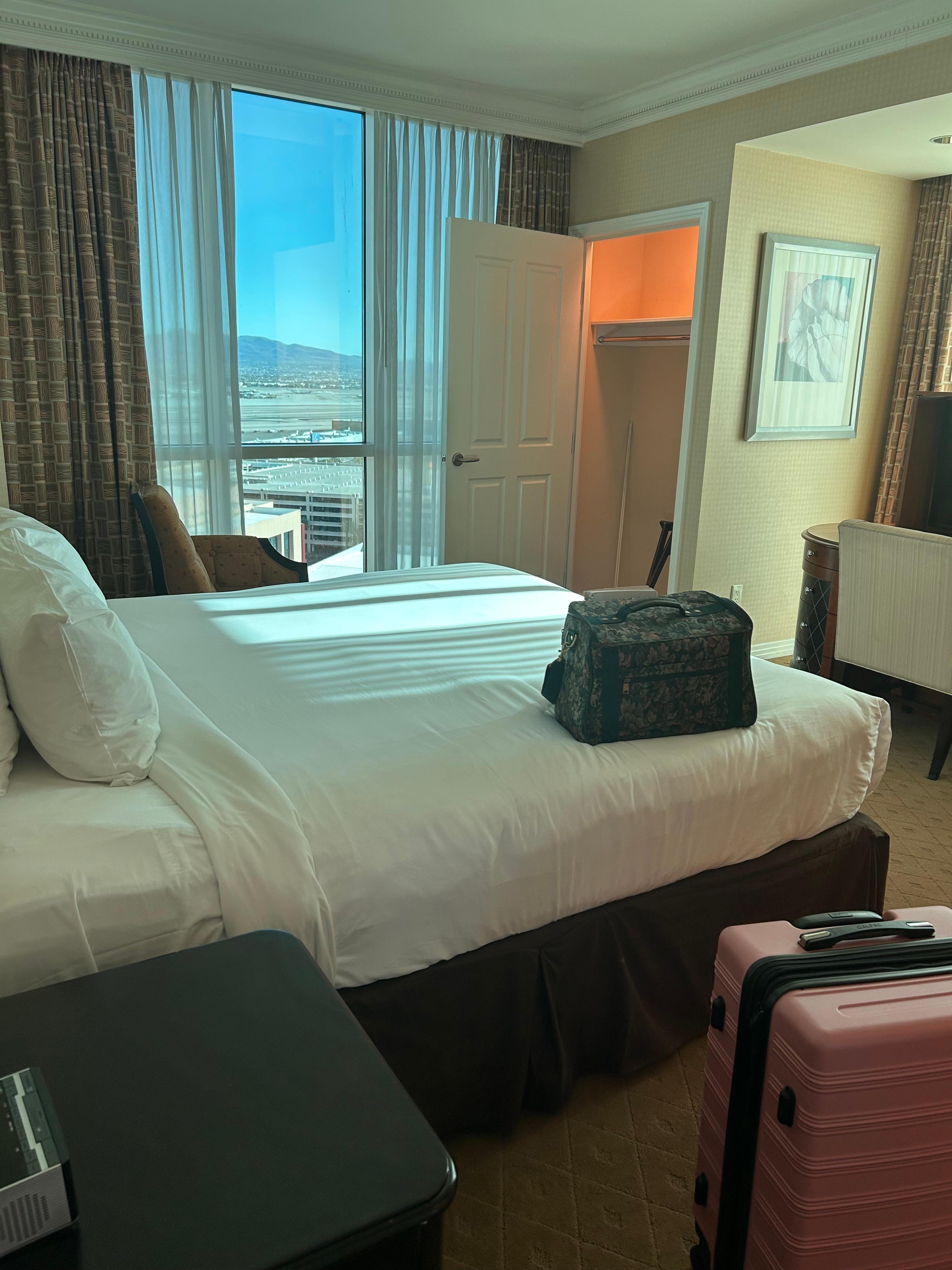 Has two closets. Has ironing board and iron. 