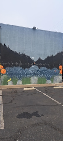 Mural on side of building.