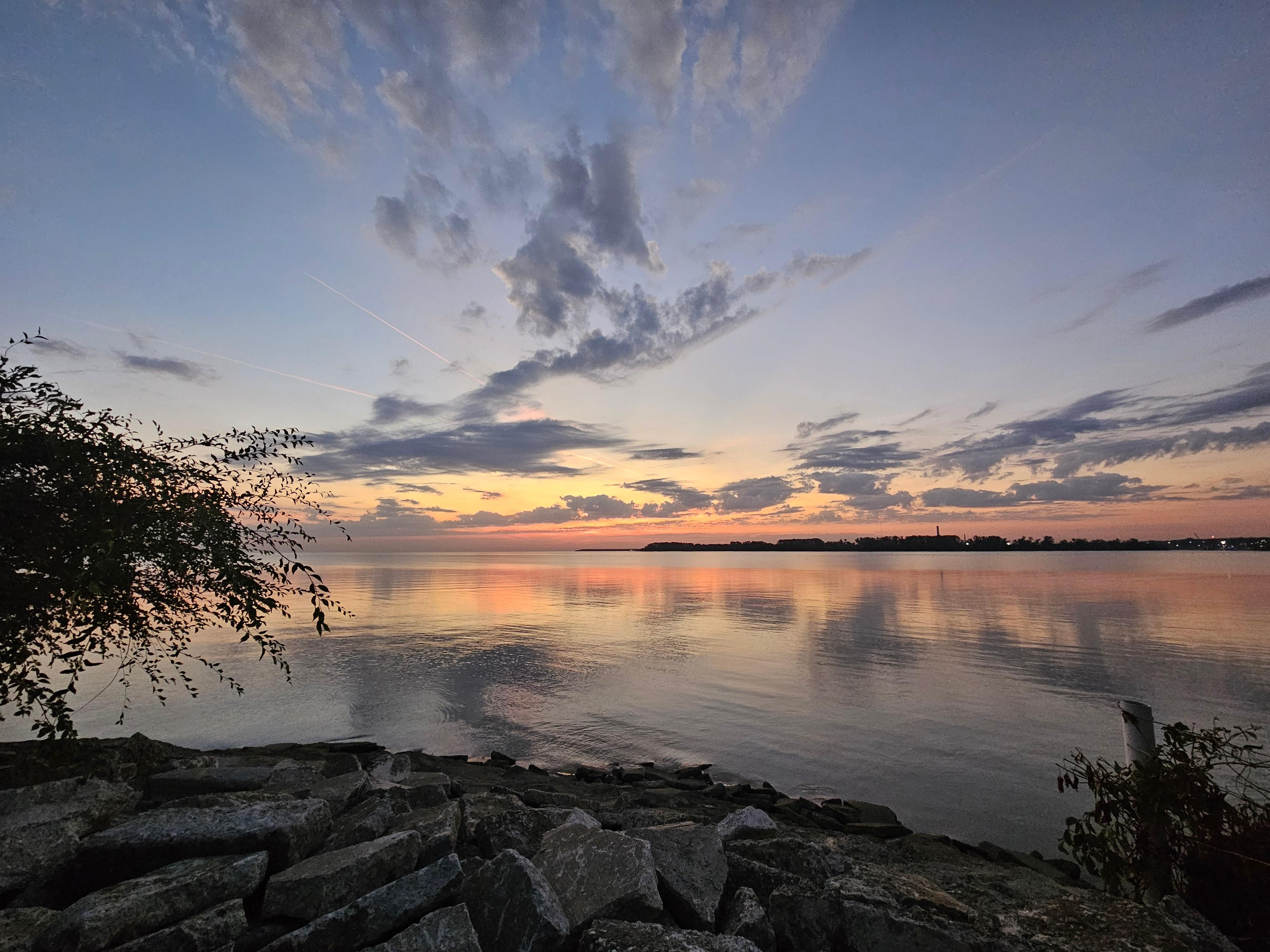 Morning sunrise from down the street or there's a bench by water 2 streets over.  