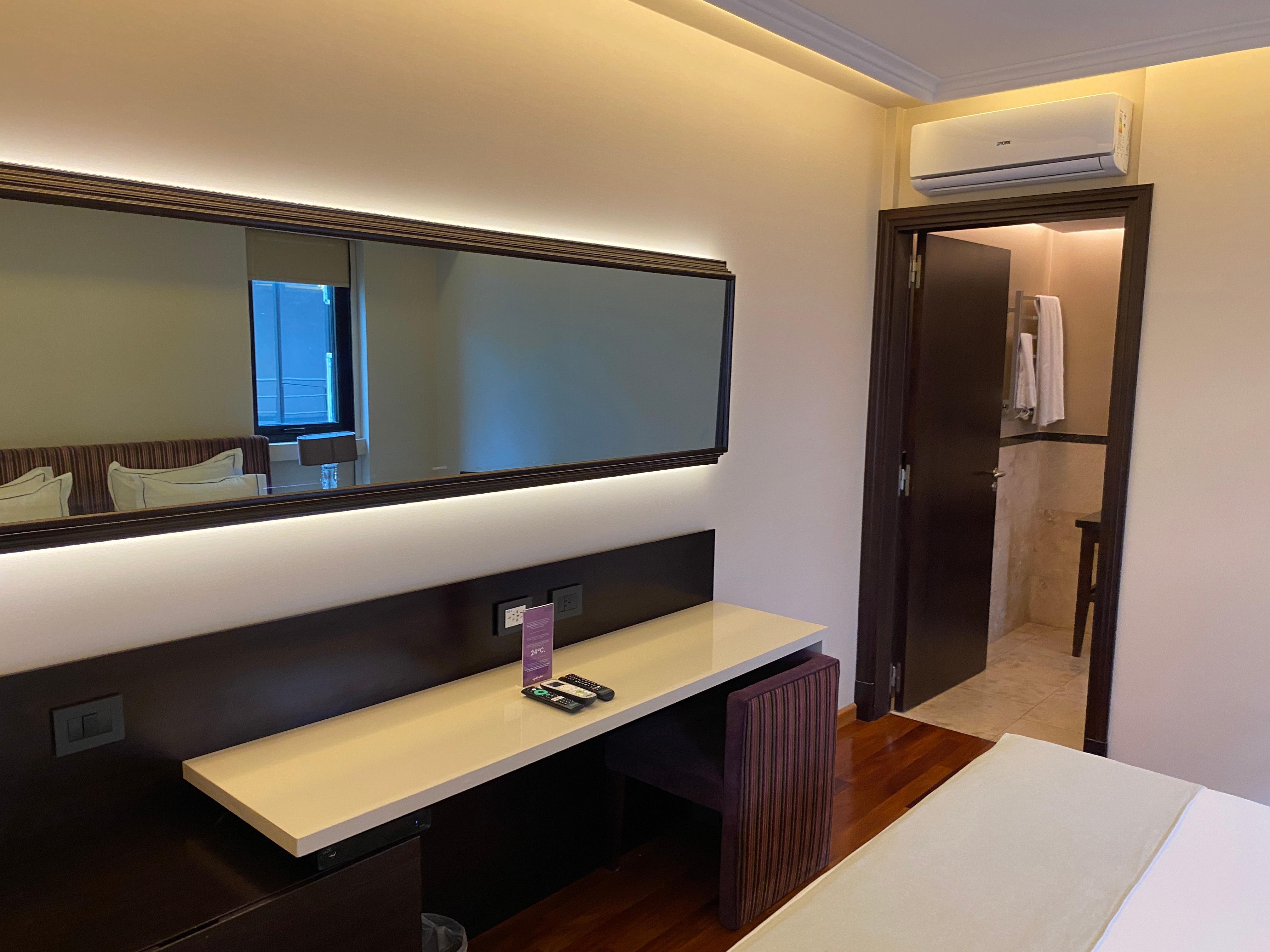 Spacious bedroom with TV in the mirror!
