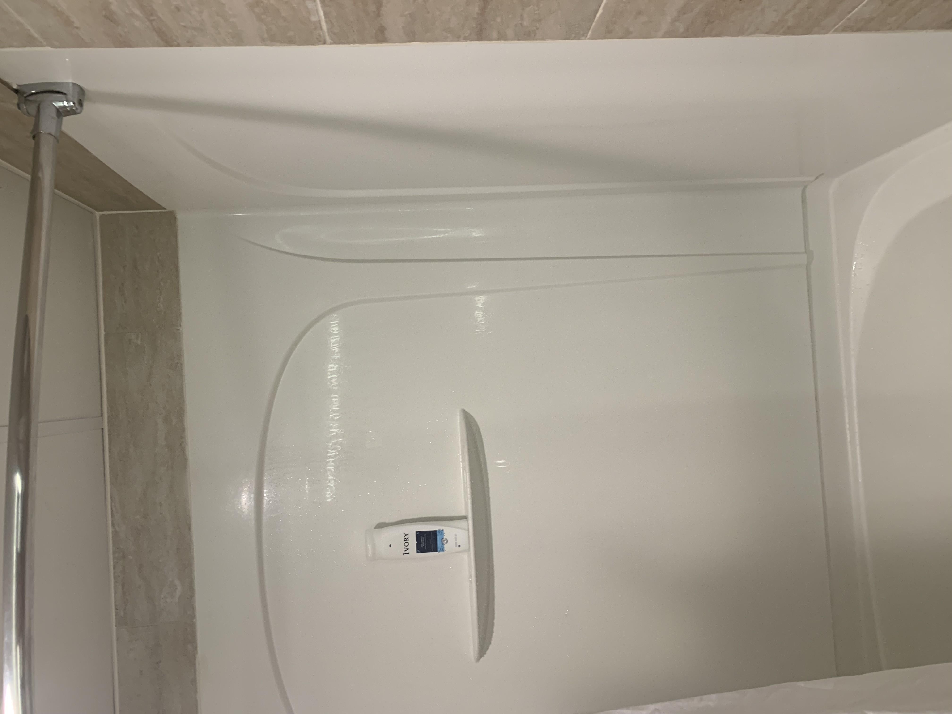 Bar holding shower Curtain-we used to get in and out of the shower