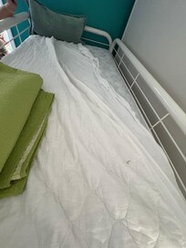 Top bunk covered in dirt/food