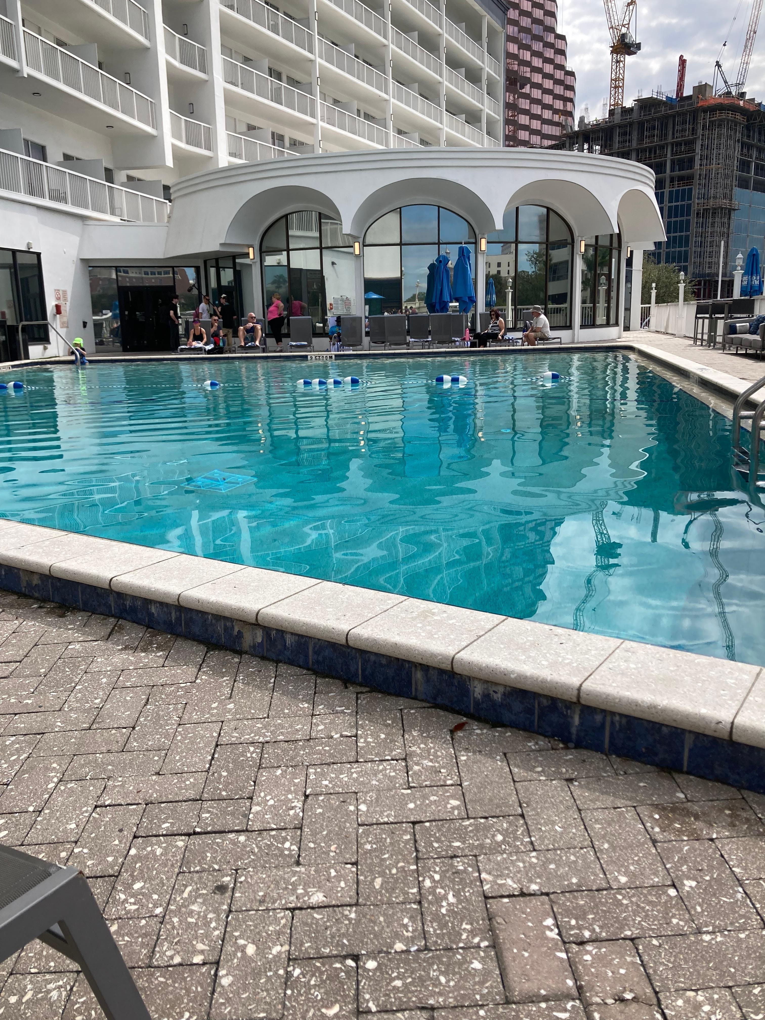 The pool was nice with outside bar for drinks and food .