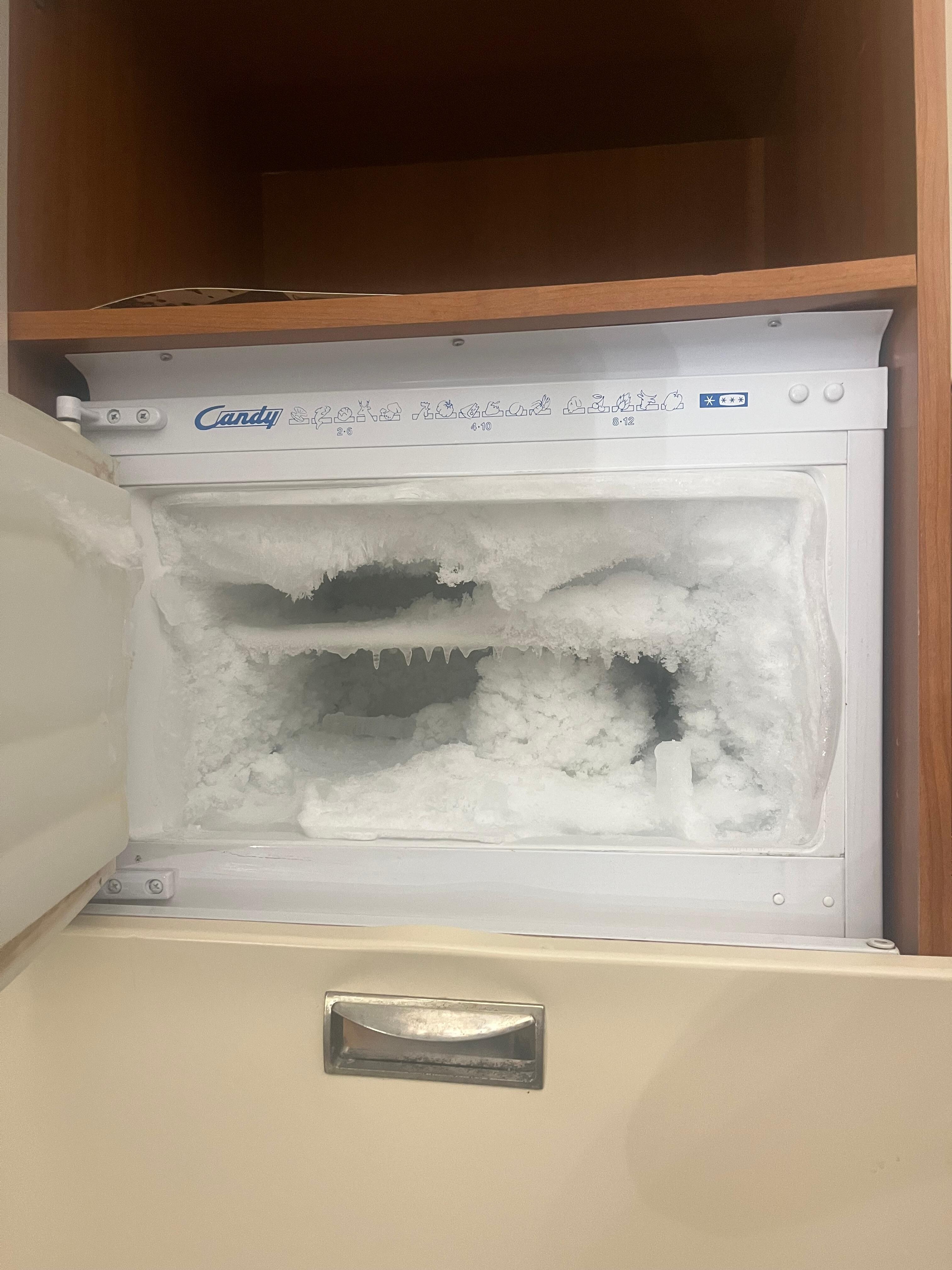 We had to chip away ice in the freezer just to fit a bottle of wine. 