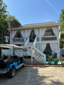 Suite B is on the first floor. Suite A is on the third floor with hot tub and lounging area on the visible deck. Suite C is around back (not visible in picture)