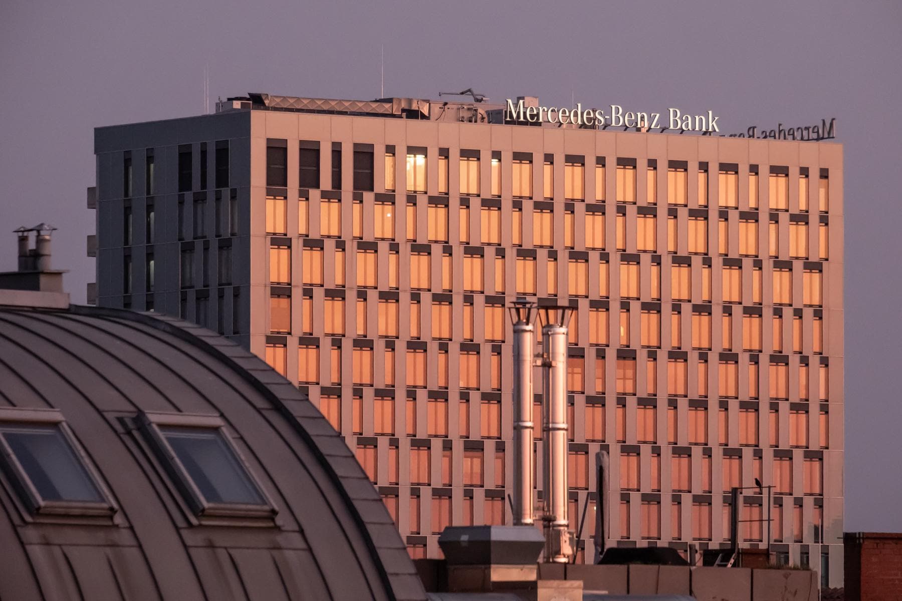 View of the Mercedes-Benz Bank at sunset from the roof terrace