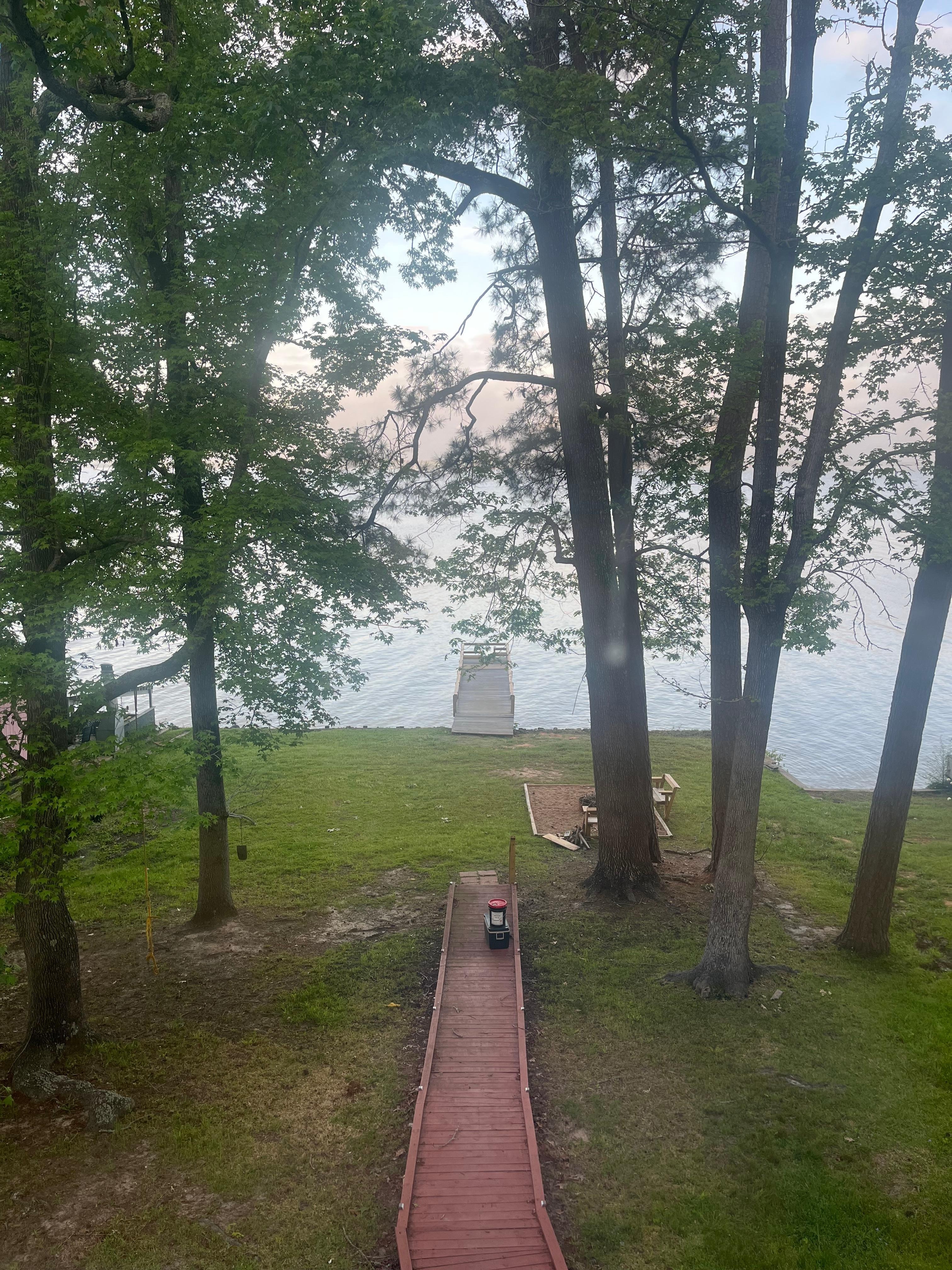 Standing on the front deck facing the water. The fishing pier is very nice with seats 