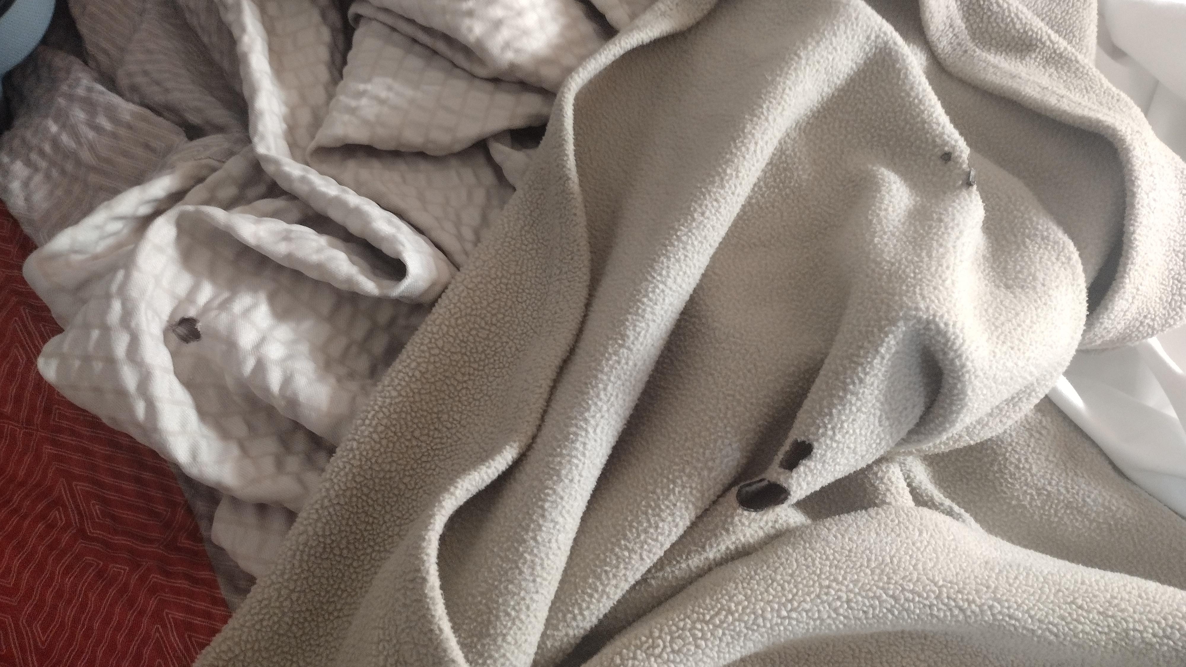 Cigarette burn holes in the bedding.
