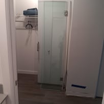 Shower glass doors in hallway