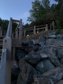 Taken from the beach just before sunrise. The steps have solar lights and so pretty!
