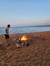 Swimming while prepping a campfire