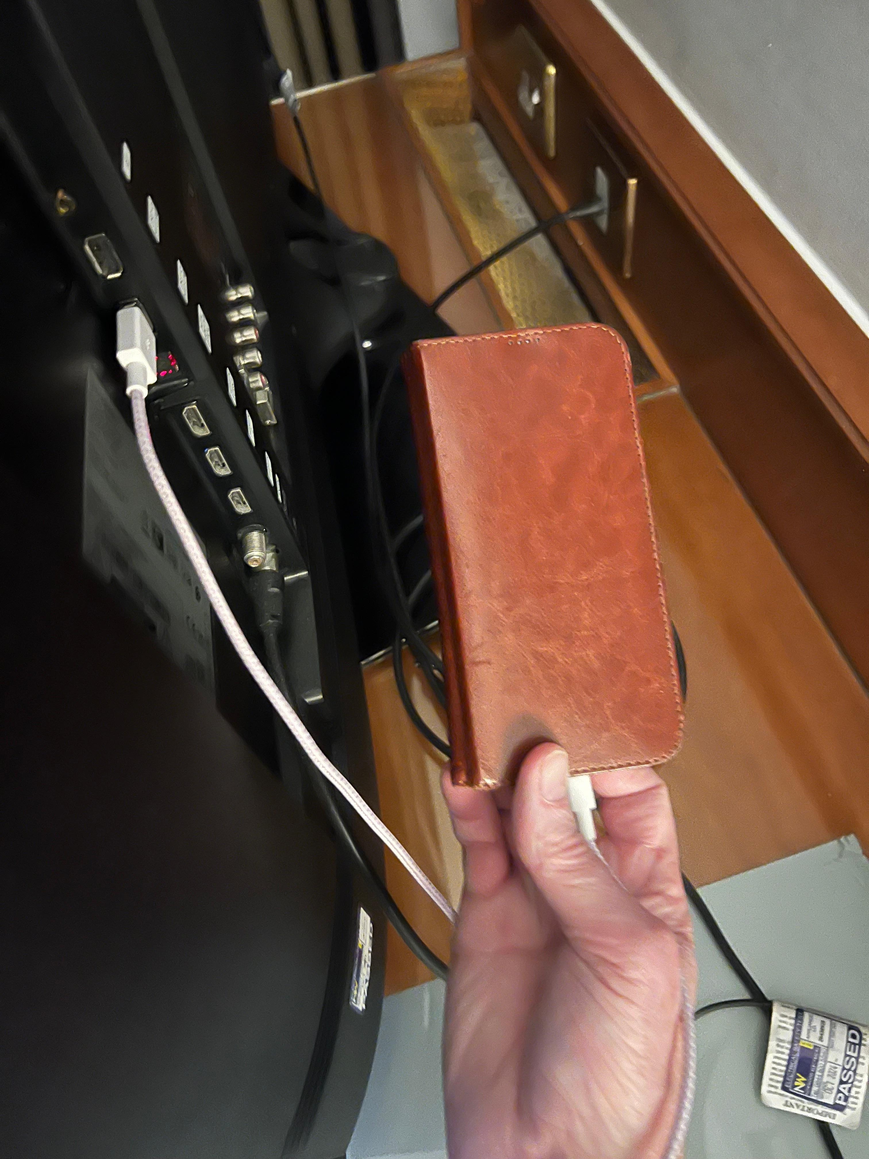 Connecting our phones to the TV USB port to charge