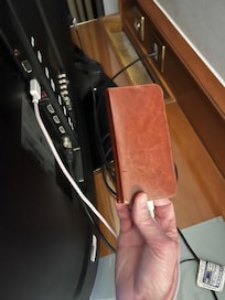 Connecting our phones to the TV USB port to charge