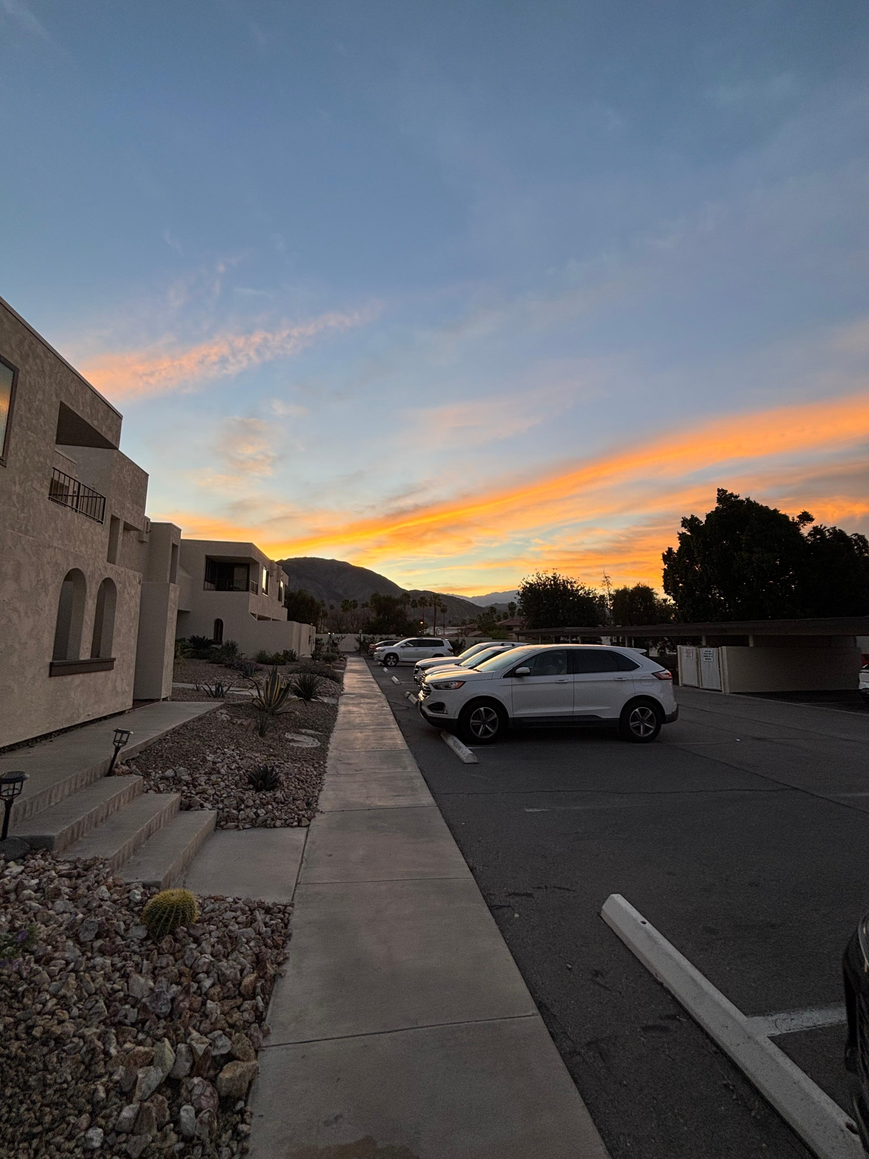 Parking lot - unit 1 does overlook it. So it’s not a great view from the bedroom balcony but the gorgeous sunsets more than make up for it! 