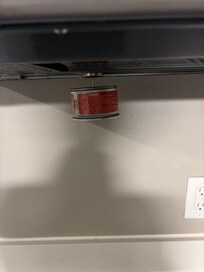 Not sure what this was hanging underneath the microwave