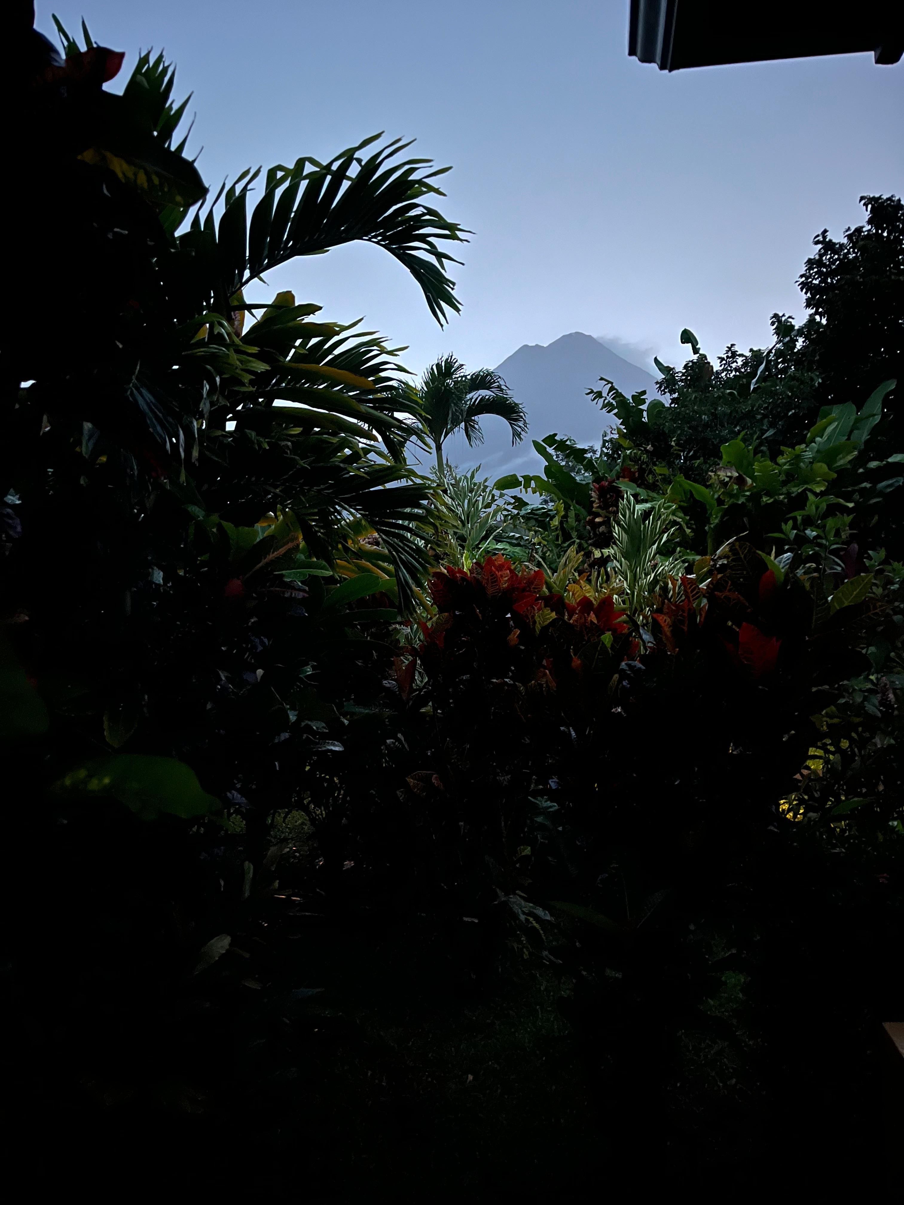 Evening view from hotel room. La fortuna volcano in the distance.