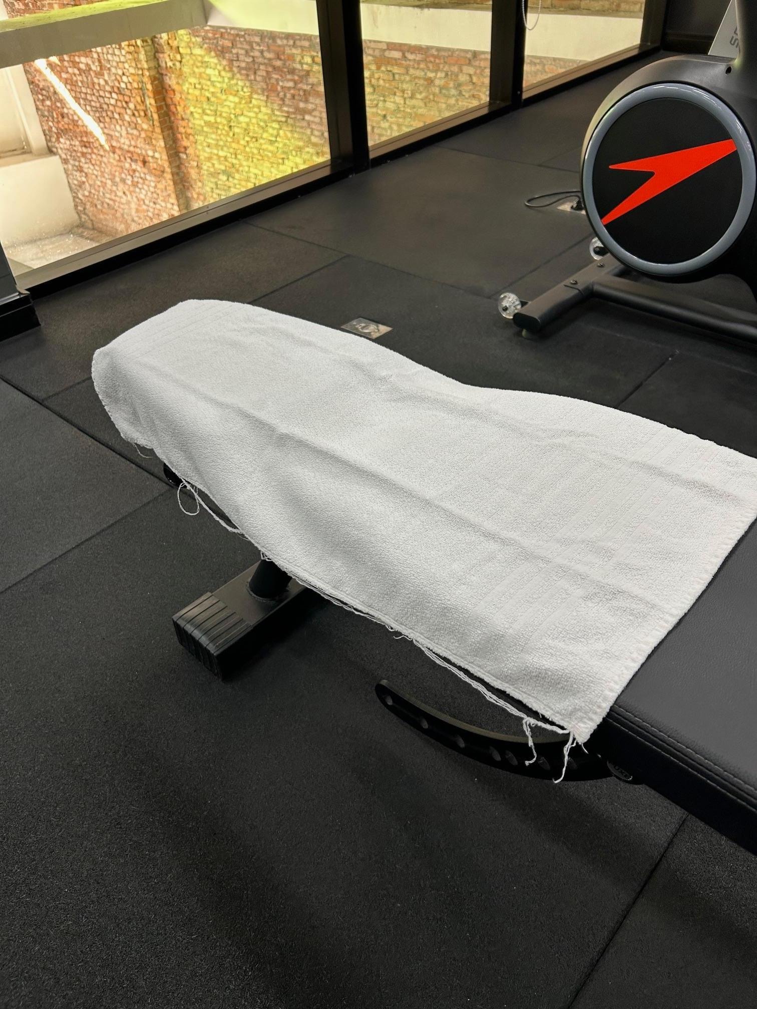weight bench, threadbare towels