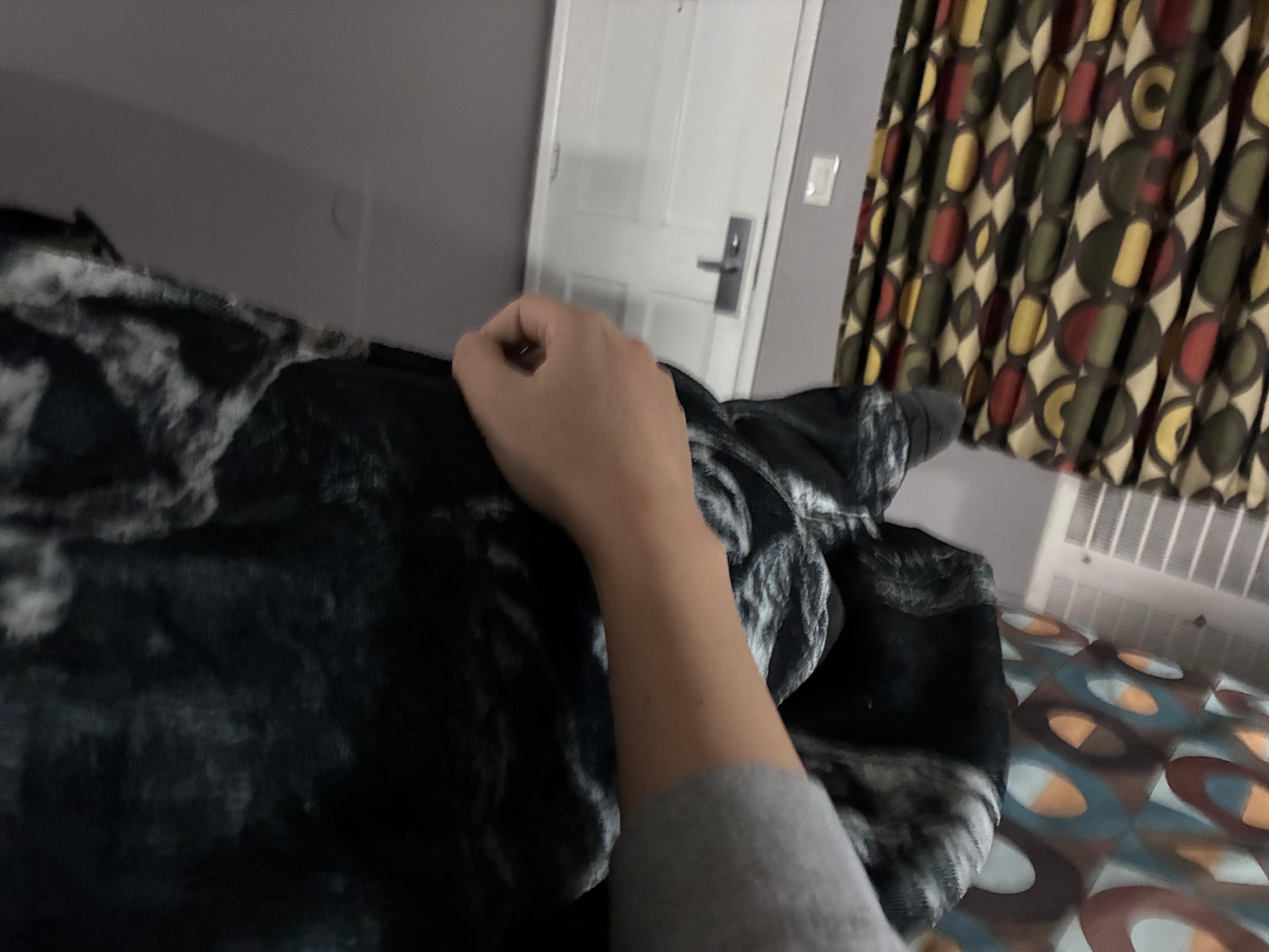 Sleeping atop uncomfortable unclean bed. Looking at the window blinds that close with a literal wooden clothing pin. 