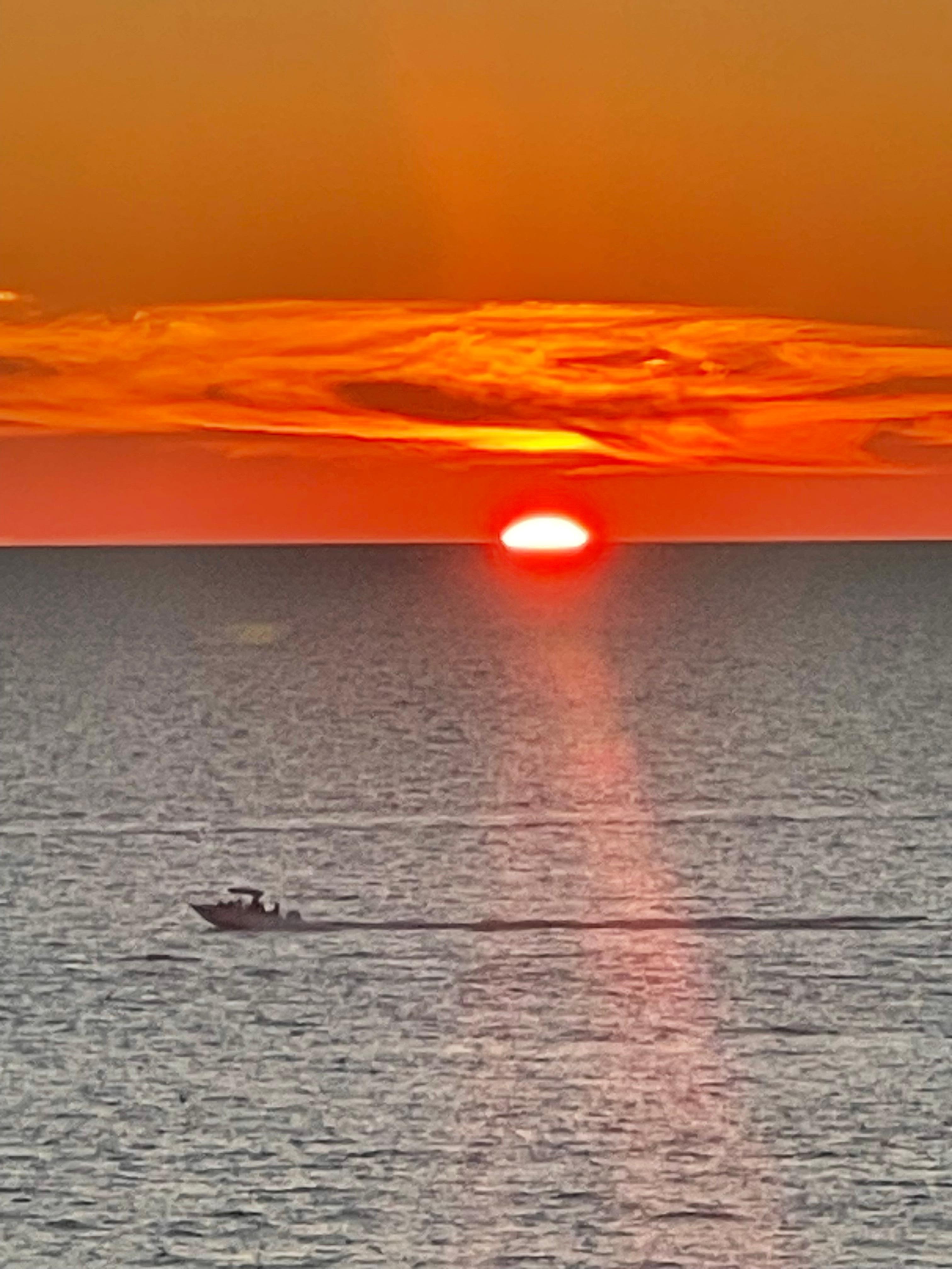 What a relaxing way to spend the evening out on a large balcony watching the sunset!