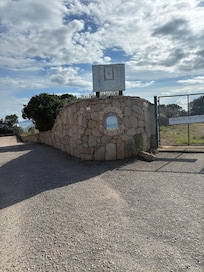 After the roundabout make sure to veer to the right at this sign. It is a dirt road.