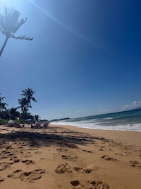 Beautiful soft sandy beach steps in front of the property