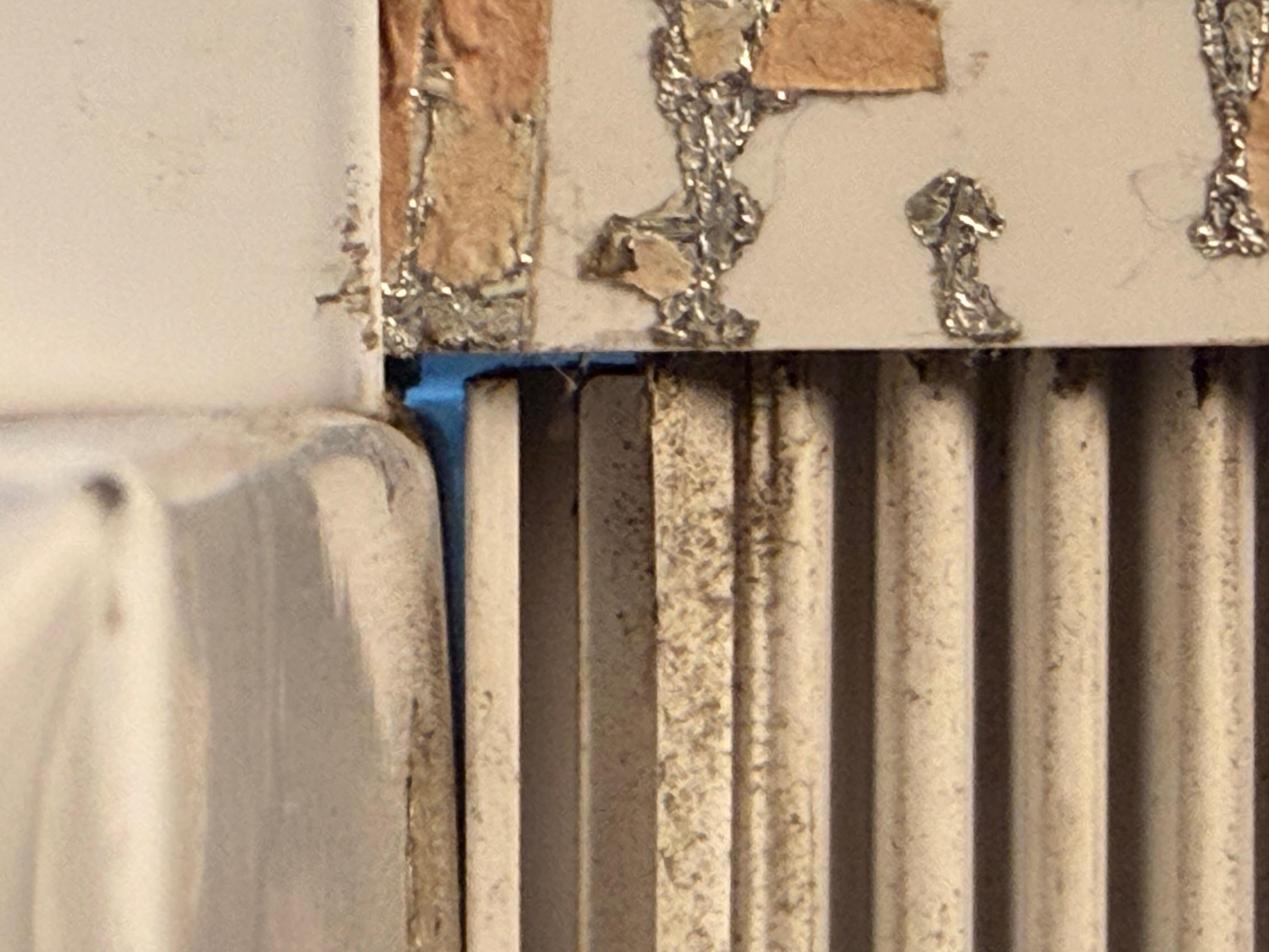 Holes in the wall where you can see the outside. A cold draft kept coming in.