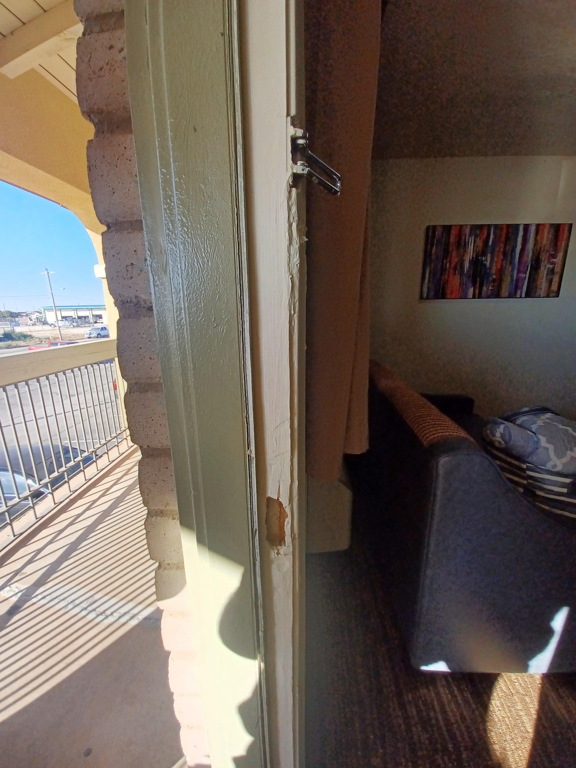 Busted and poorly repaired door jam.