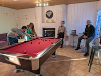 Enjoying a competitive game of billiards