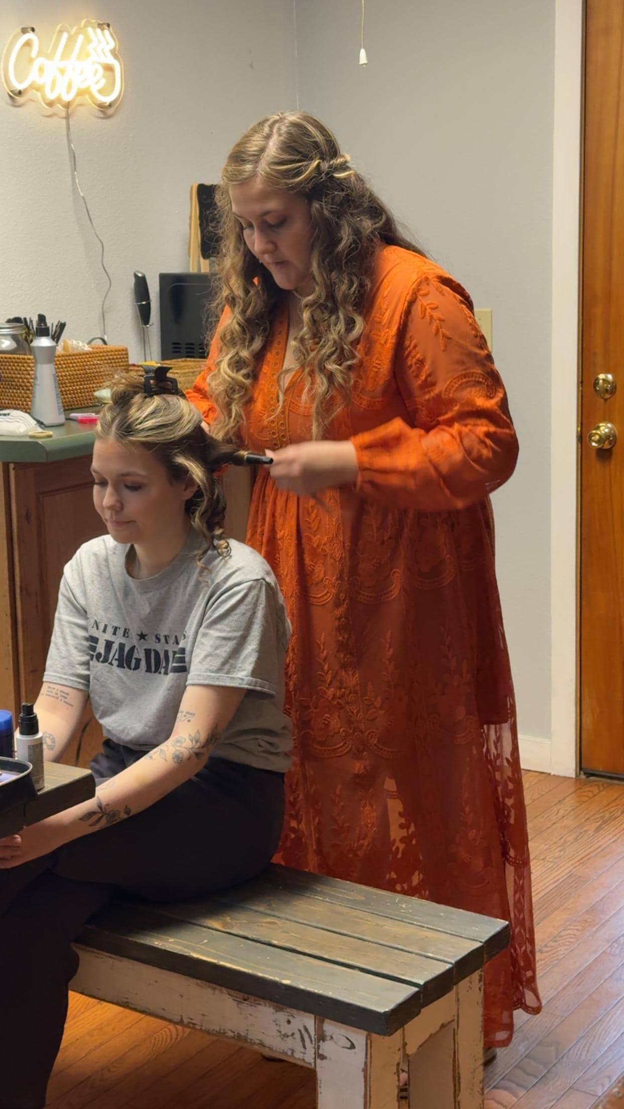 Maid of honor doing personal attendants hair
