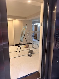 The photo shows active construction on the 41st floor — scaffolding, cables, and debris in the hallway, making it look more like a work zone than a hotel area.