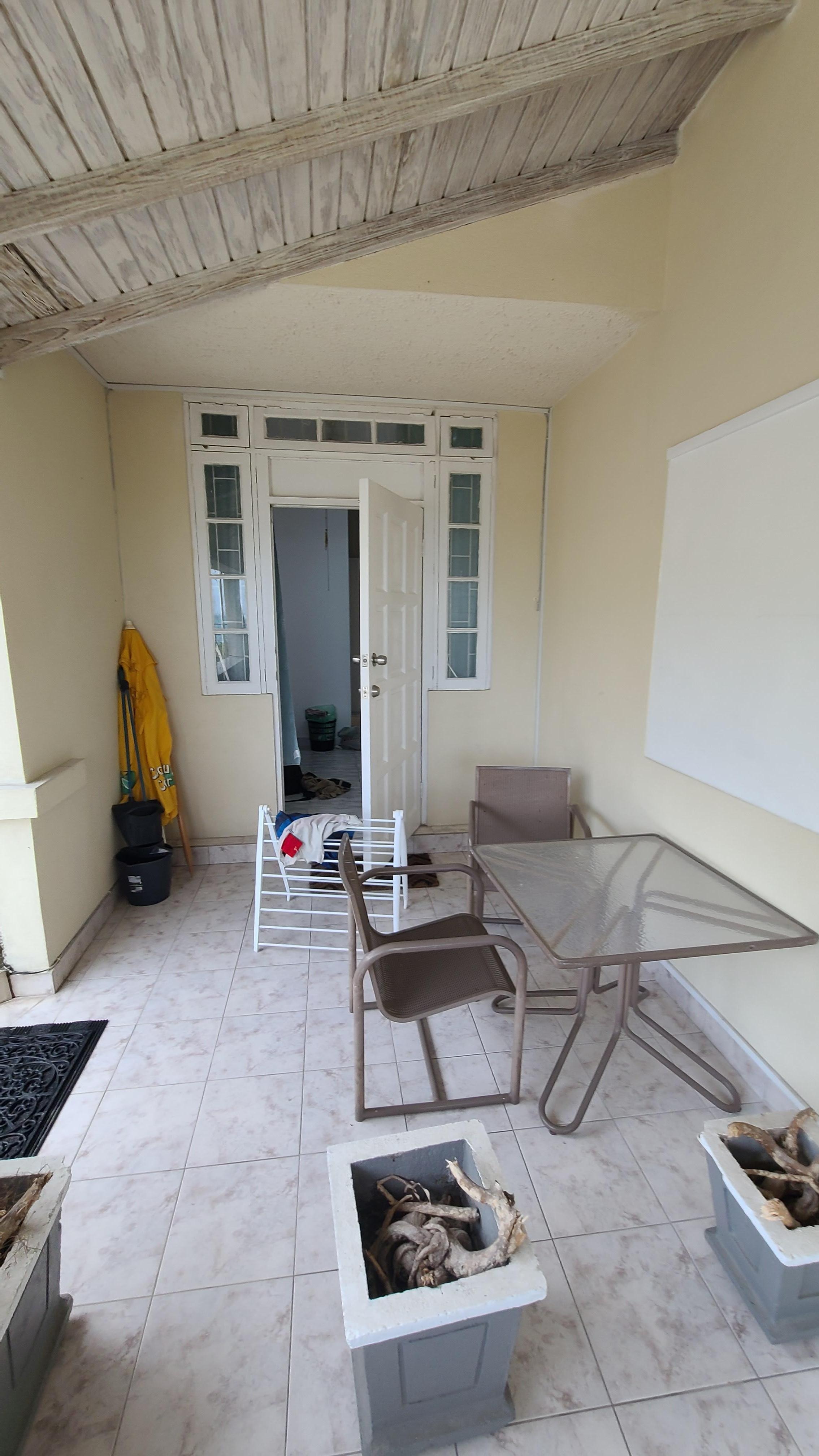 Terrace area in front of apartment door. 