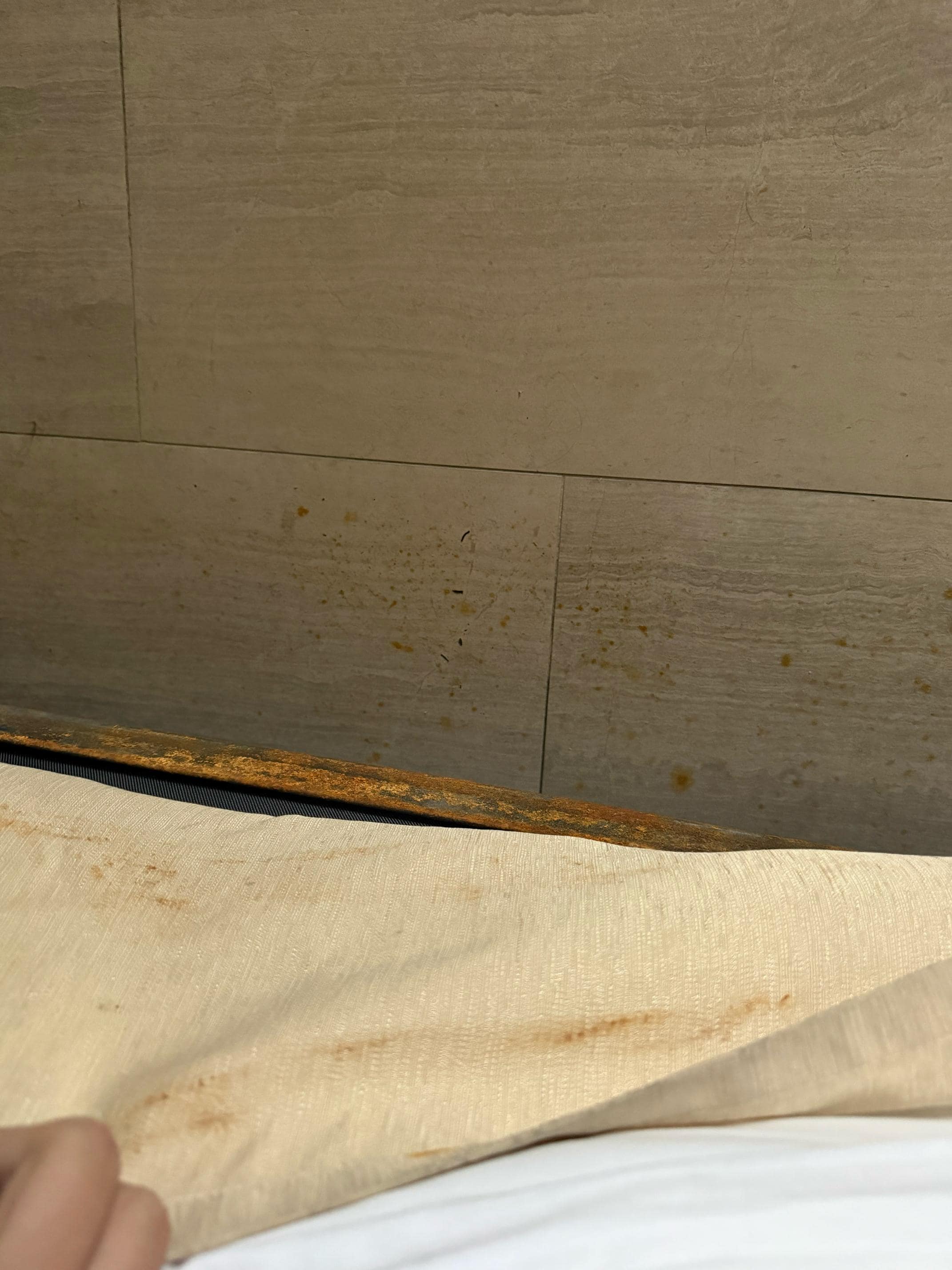 Rust or something on the headboard.