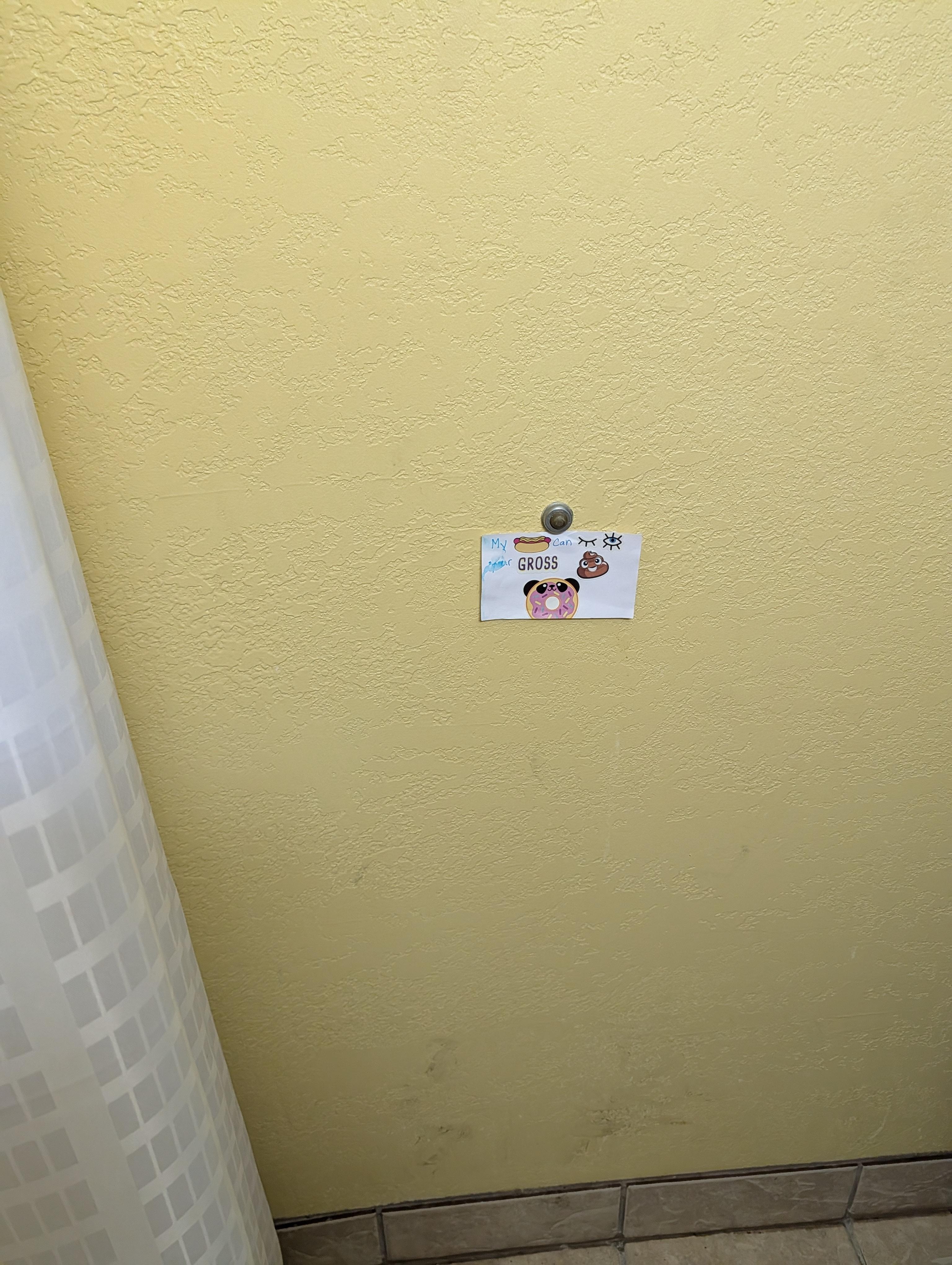 This sign was taped to the bathroom wall.