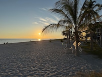 Sunset from beach directly in front of complex