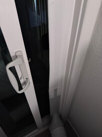 The 2nd bedroom balcony door that does not close or lock.