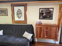 The open living room and bedroom