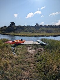 Kayak and paddleboard launch by the creek just nestled past the backyard.