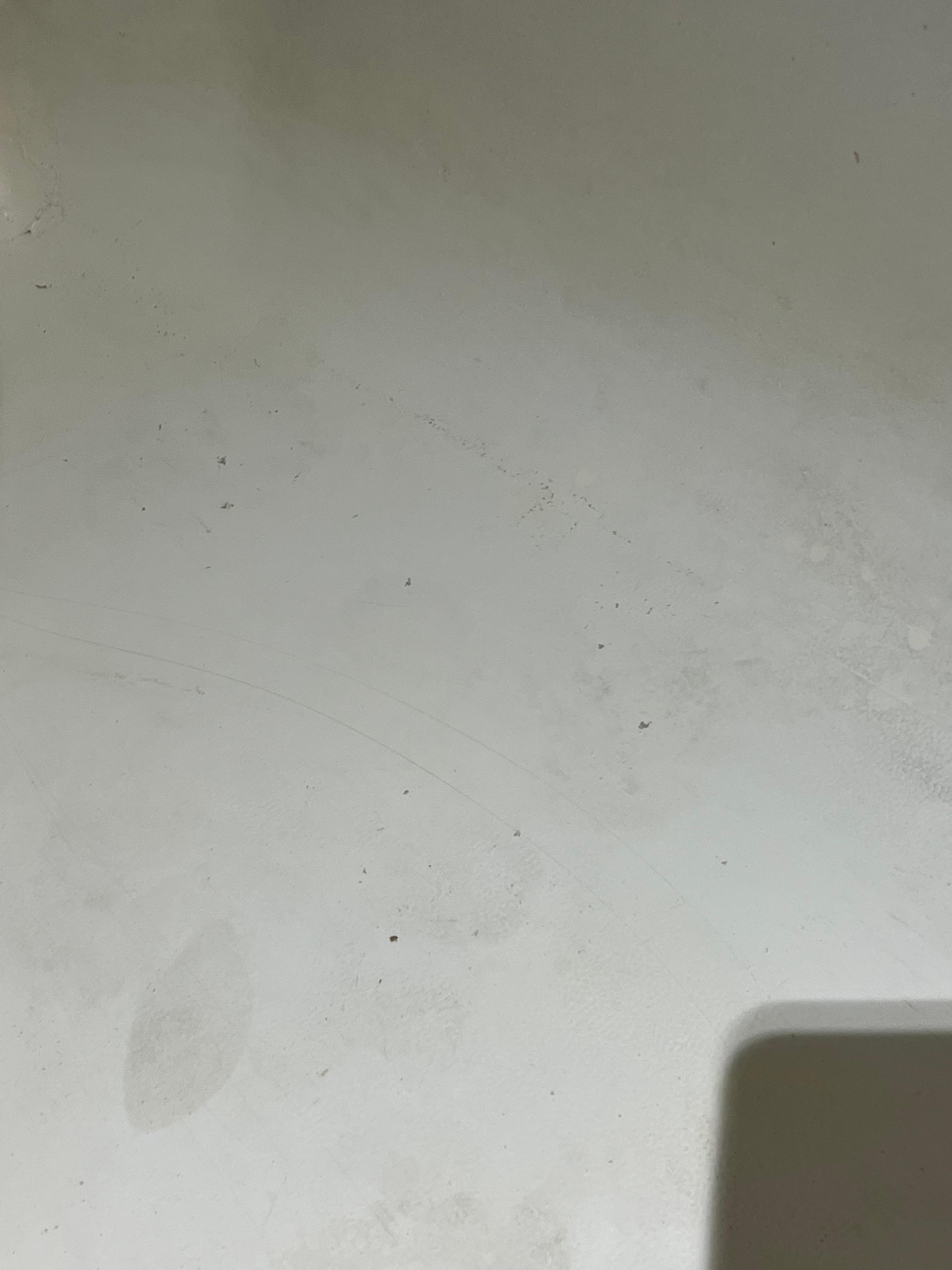 Dirty floor of shower. 