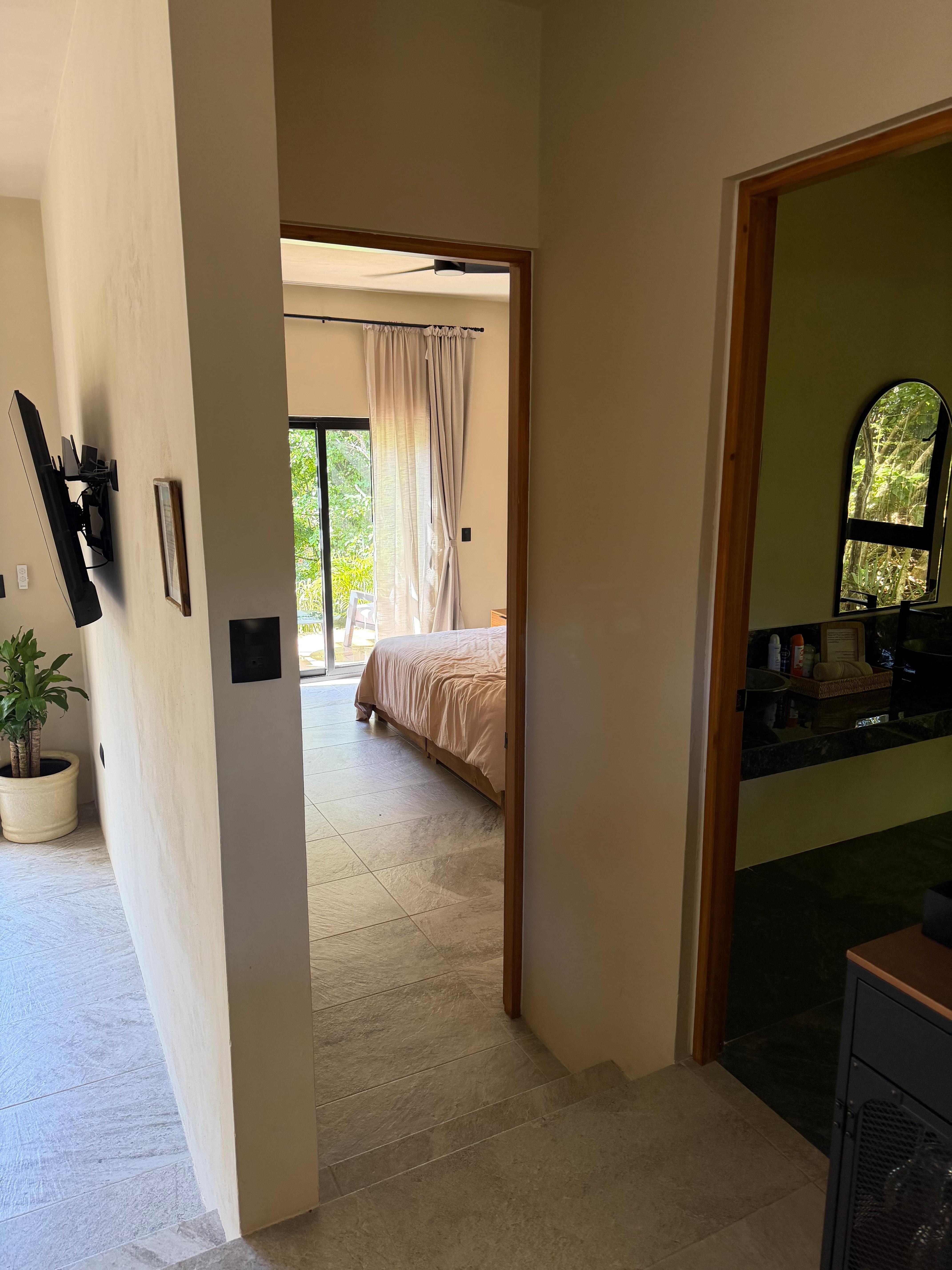 Peekaboo view of the guest room and main bathroom. 