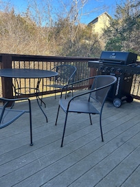 Squirrel hanging out while enjoying the deck.