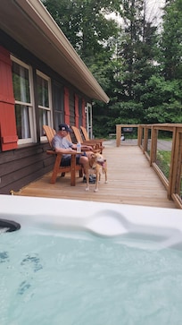 Our grandpa and dog enjoying the porch
