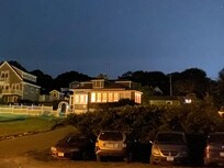 Pretty night view of front of cottage