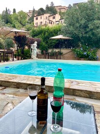Patio and pool with local wine provided by B&B