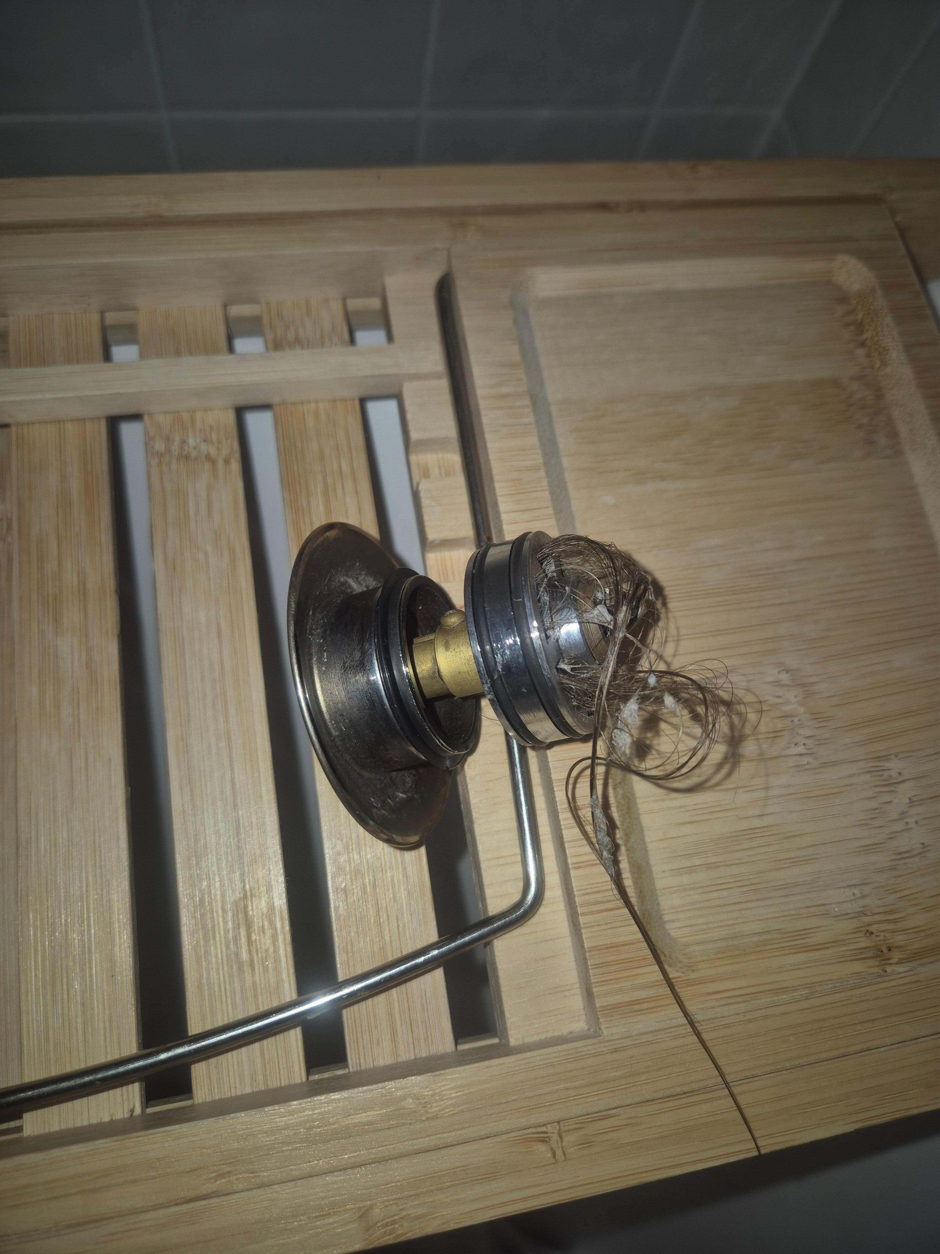 Bath tub plug full of hair. Cleaners need to make sure things like this is clean 