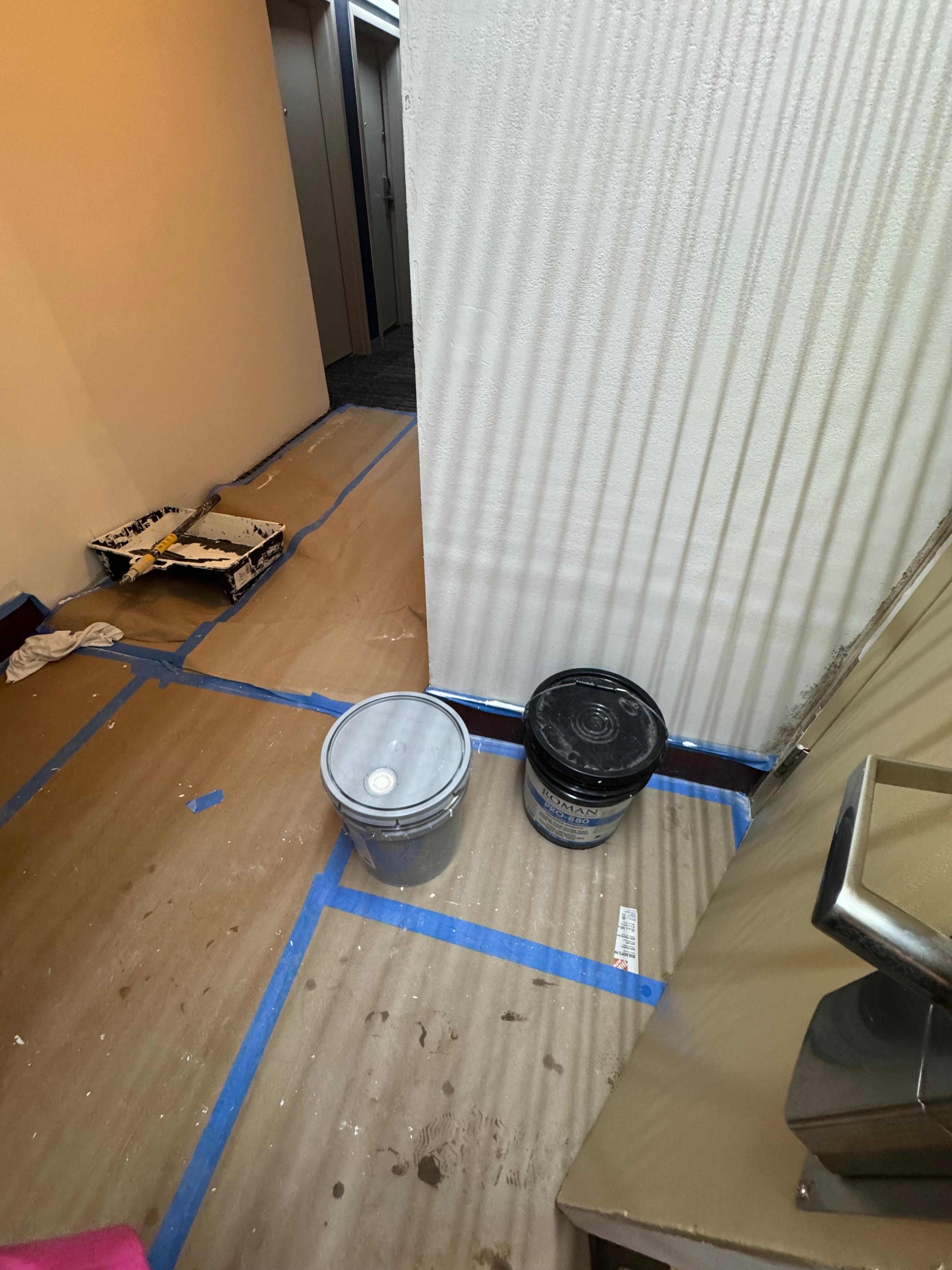 Construction materials near pool entrance.