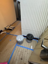 Construction materials near pool entrance.