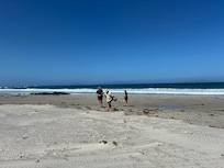 Walking on the beach in front of the Beach House
