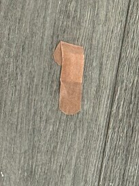 This bandaid was stuck to the floor in the hallway for 4 days! Gross!
