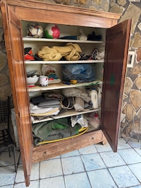 Clutter, trash, and unkept outdoor kitchen area