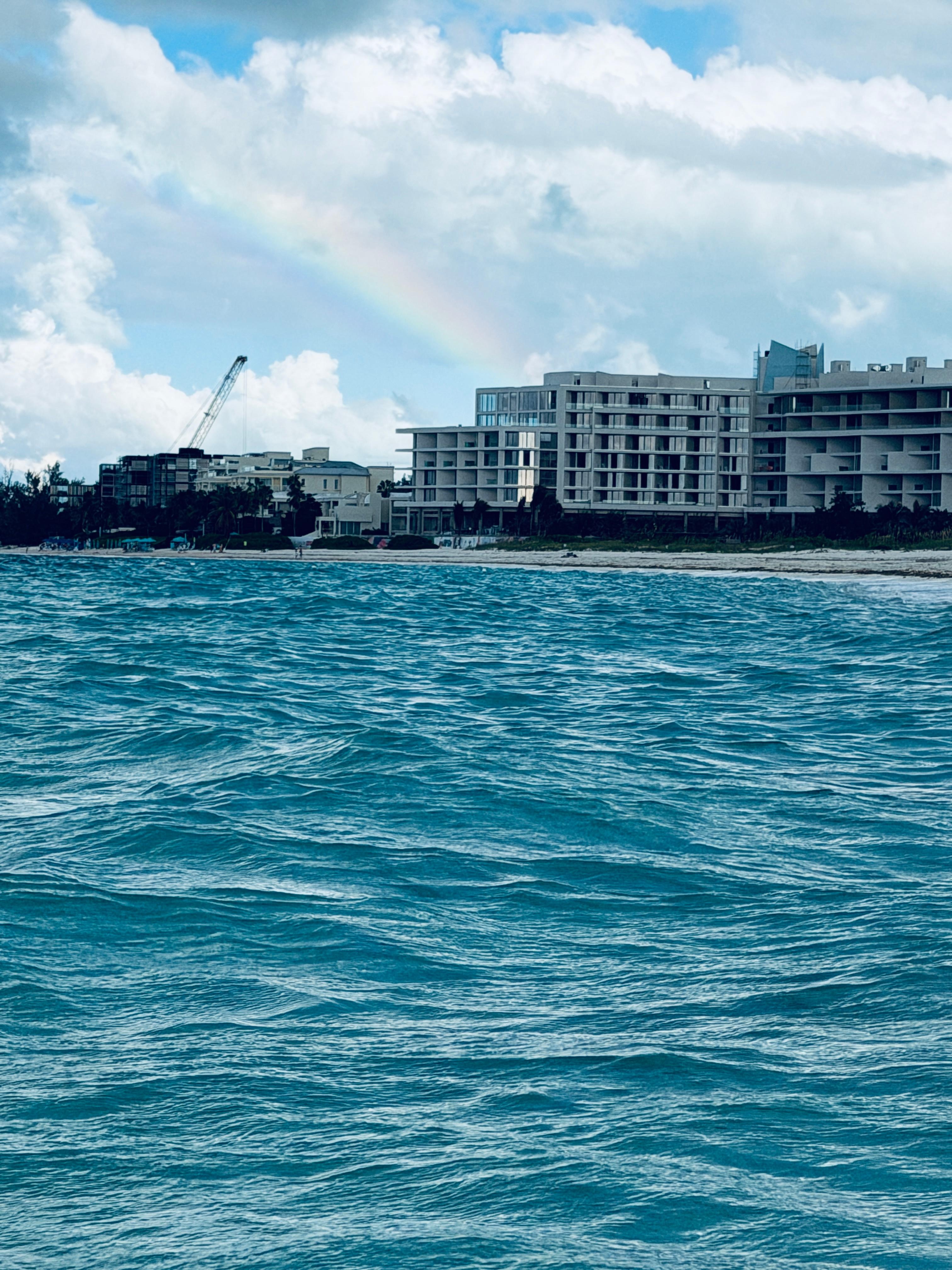 Rainbow over turquoise waters. 